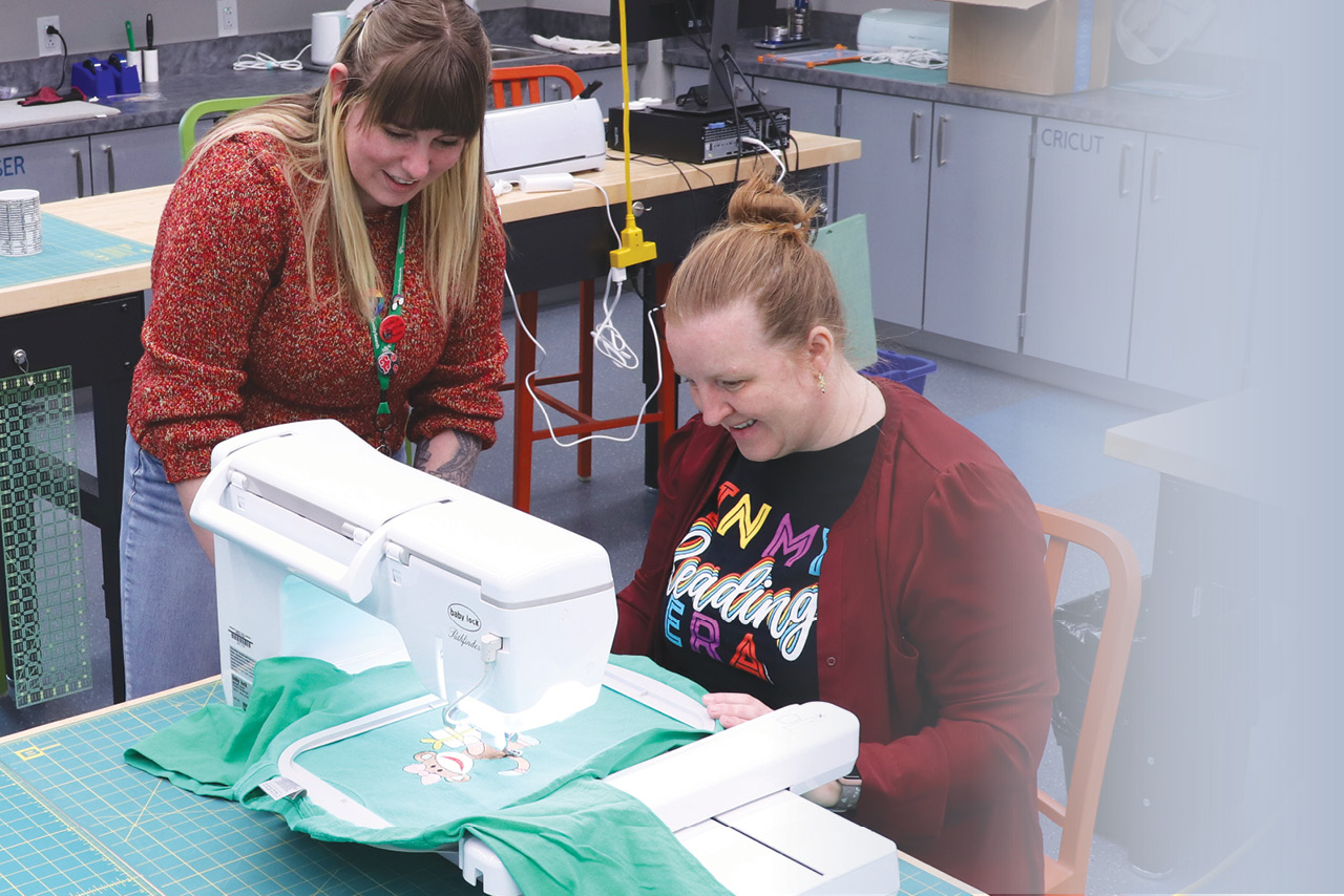 a person using a sewing machine