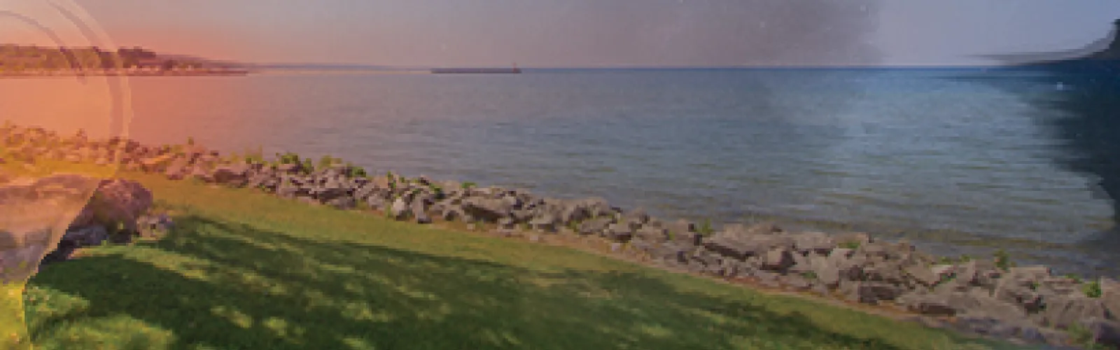 a rocky shoreline of a lake