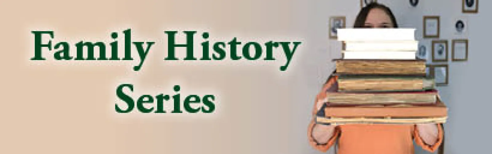 a person holding a large pile of books