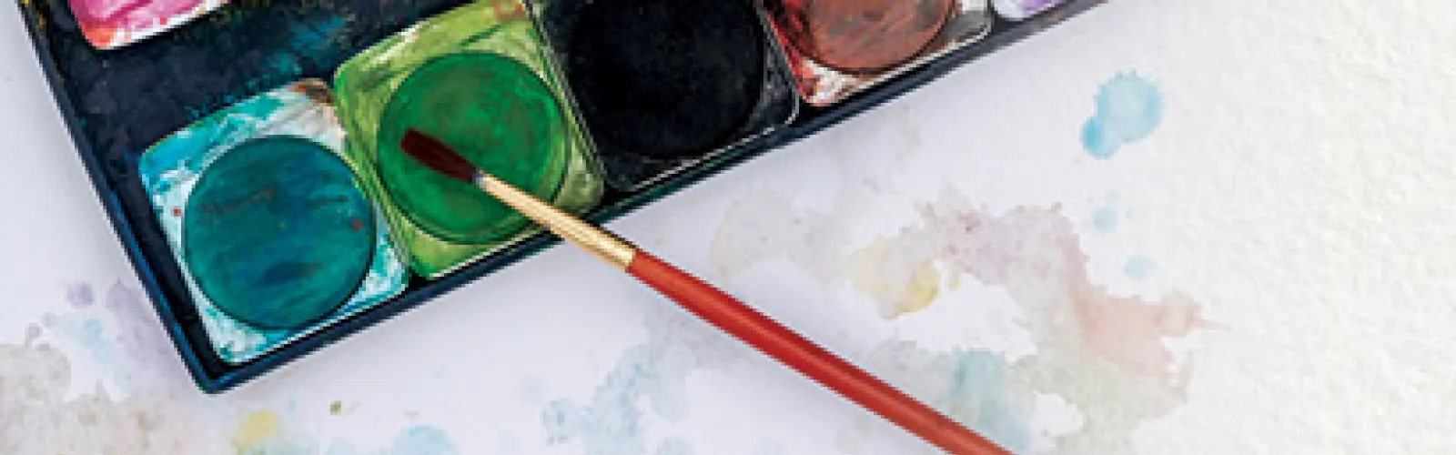 Paintbrush and watercolors